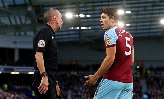Soccer Football - Premier League - Brighton & Hove Albion vs Burnley - The American Express Community Stadium, Brighton, Britain - December 16, 2017 Burnley's James Tarkowski protests to the assistant referee after a penalty was awarded to Brighton REUTER