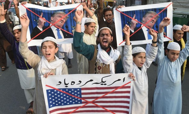 Pakistani demonstrators protest US aid cuts in Lahore - AFP
