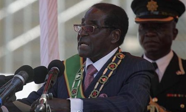 Zimbabwe's President Robert Mugabe addresses supporters during celebrations to mark the country's Defence Forces Day in the capital Harare, August 13, 2013. REUTERS/Philimon Bulawayo