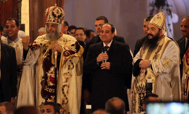 FILE- Sisi congratulates Copts at Christmas mass in Cairo's Abbasiya cathedral, 2016