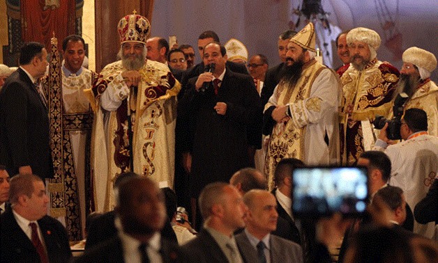 FILE- Sisi congratulates Copts at Christmas Mass in Cairo's Abbasiya cathedral in 2016