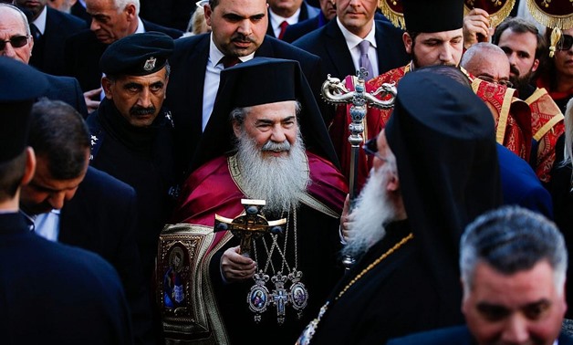 Greek Orthodox Patriarch Theophilos III arrives at the Church of the Nativity in the West Bank - AFP
