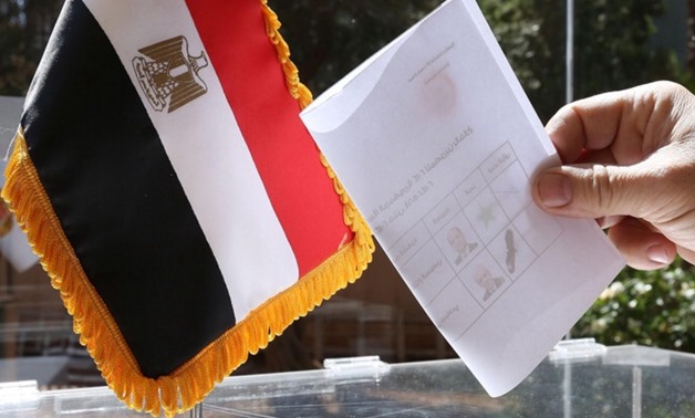 FILE - Egyptian national casting his vote in 2014 Presidential Election at Embassy in Lebanon - AFP