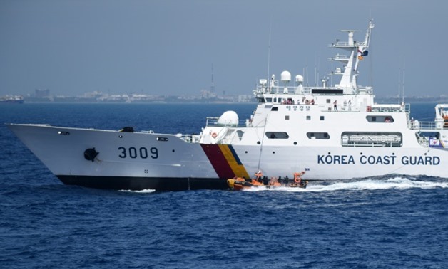 South Korea has sent a plane and coastguard ship to help after an oil tanker collided with a cargo ship off the coast of east China leaving 32 people, mostly Iranians, missing - ARUN SANKAR (AFP/File)