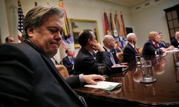 White House Chief Strategist Stephen Bannon (L) attends a meeting between U.S. President Donald Trump and congressional leaders to discuss trade deals at the at the Roosevelt room of the White House in Washington U.S., February 2, 2017. REUTERS/Carlos Bar