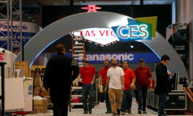Workers walk through Las Vegas Convention Center lobby as they prepare for the 2018 CES in Las Vegas, Nevada, U.S. January 5, 2018. REUTERS/Steve Marcus
