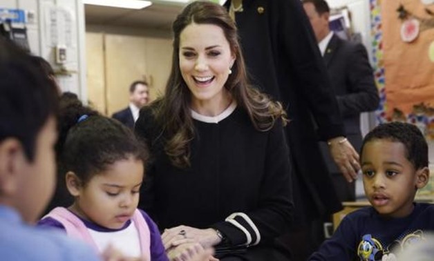 Kate Middleton, the Duchess of Cambridge, laughs while sitting next to April age 4, (L), and Sammy age four, in a pre-school class, December 08, 2014 03:49pm EST - Seth Wenig-Pool/Getty Images