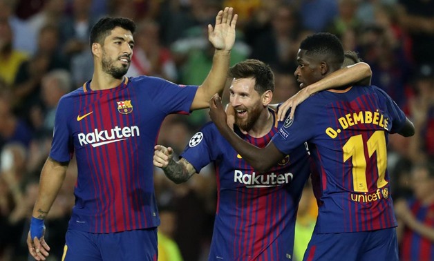Spain - September 12, 2017 Barcelona's Lionel Messi celebrates scoring their third goal with Luis Suarez (L) and Ousmane Dembele (R) REUTERS/Susana Vera 
