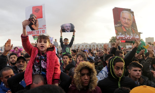 Supporters of Eastern Libyan military commander Khalifa Haftar take part in a rally demanding Haftar to take over after a U.N. deal for a political solution missed what they said said was a self-imposed deadline on Sunday, in Benghazi, Libya, December 17,