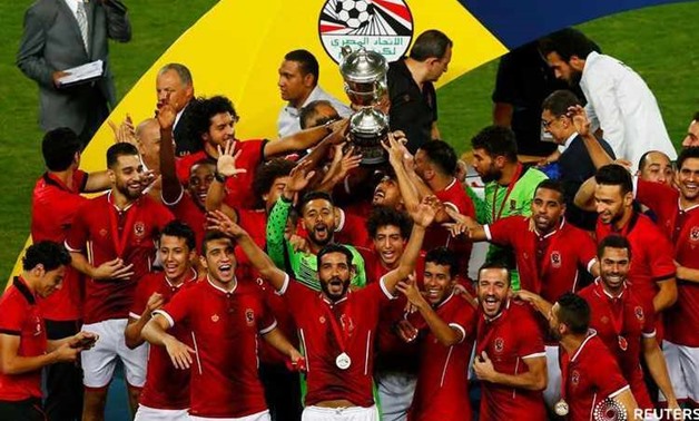 Soccer Football - Egyptian Cup Final - Al Masry v Al Ahly - Alexandria, Egypt - August 15, 2017 Al Ahly players celebrate winning the Egyptian Cup with the trophy REUTERS/Amr Abdallah Dalsh