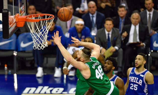 Jan 11, 2018; London, ENG; Boston Celtics Centre Aron Baynes (46) is fouled by Philadelphia 76ers Centre Joel Embiid (21) during the first quarter of the game at The O2 Arena. Mandatory Credit: Steve Flynn-USA TODAY Sports
