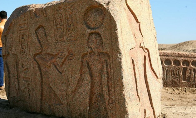 A stela carved in red granite depicting 19th Dynast King Ramses II presenting offerings to an ancient Egyptian deity – Ministry of Antiquities Facebook page  

