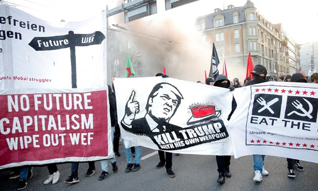 Anti-Trump demonstrators march in Swiss capital - Reuters