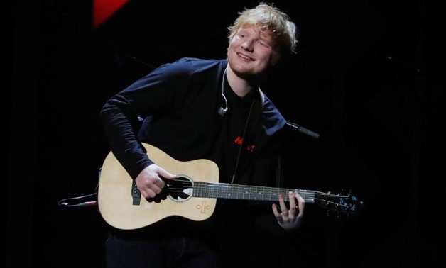 FILE PHOTO - Ed Sheeran performs during the 2017 Jingle Ball at Madison Square Garden in New York, U.S., December 8, 2017. REUTERS/Lucas Jackson
