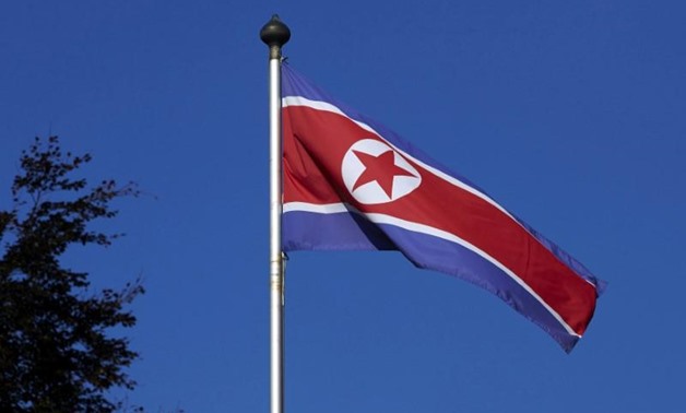 FILE PHOTO - A North Korean flag flies on a mast at the Permanent Mission of North Korea in Geneva October 2, 2014. REUTERS/Denis Balibouse