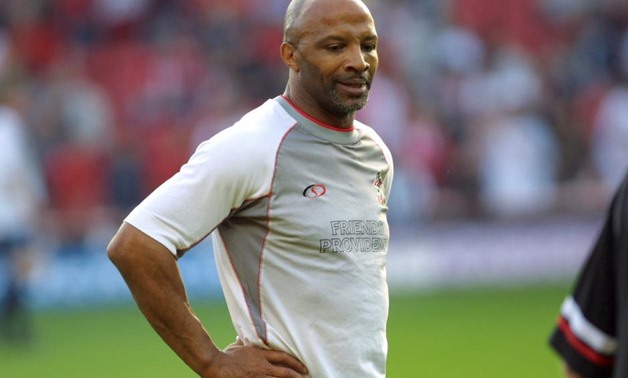Cyrille Regis takes part in a Southampton v All Star XI benefit match for Danny Wallaceat St Mary's Stadium in Southampton, Britain, May 17, 2004. -REUTERS/Paul Childs/File Photo