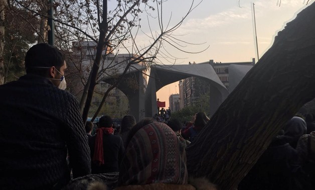FILE PHOTO: People protest near the university of Tehran in this picture obtained from social media. December 30. REUTERS