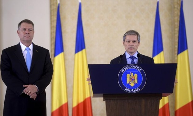 Former European Agriculture Commissioner Dacian Ciolos speaks after being appointed as Romania's prime minister by Romania's centrist President Klaus Iohannis (L) in Bucharest, Romania November 10, 2015. REUTERS/Inquam Photos/Octav Ganea