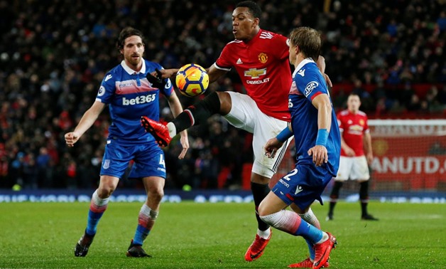 Soccer Football - Premier League - Manchester United vs Stoke City - Old Trafford, Manchester, Britain - January 15, 2018 Manchester United's Anthony Martial in action with Stoke City’s Moritz Bauer and Joe Allen REUTERS/Andrew Yates