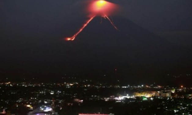 AFP | Lava spurting from Mayon volcano lights up the sky in what scientists said was a sign of increasing activity that prompted official calls for evacuation of areas under threat from a major eruption