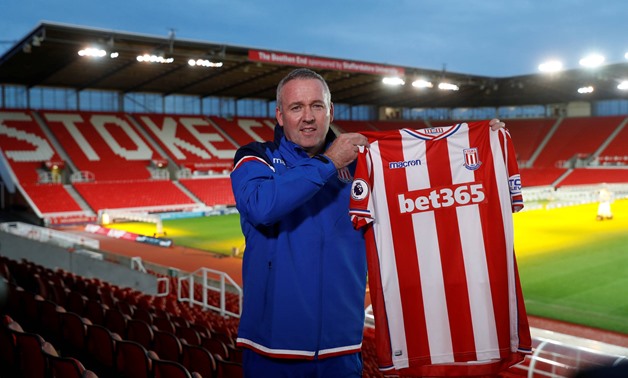 Soccer Football - Premier League - Stoke City - Paul Lambert Press Conference - bet365 Stadium, Stoke-on-Trent, Britain - January 16, 2018 New Stoke City manager Paul Lambert poses with a club shirt after the press conference Action Images via Reuters/Car