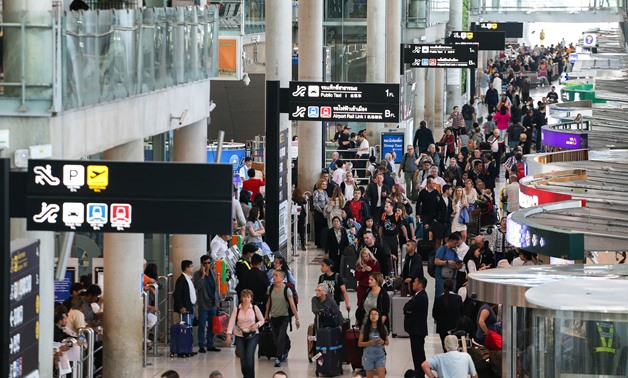 Tourists queue to check in at Suvarnabhumi International Airport in Bangkok, Thailand, January 16, 2018. REUTERS/Athit Perawongmetha