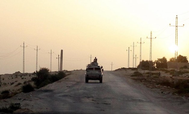 Caption: An Egyptian military vehicle is seen on the highway in northern Sinai, Egypt, in this May 25, 2015 file photo. REUTERS/Asmaa Waguih/Files
