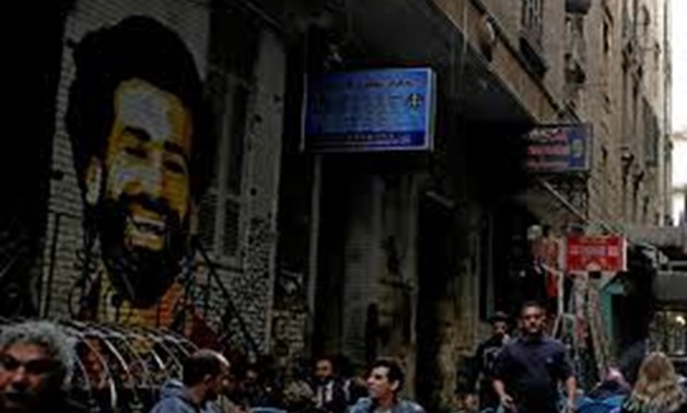 cover photo: A picture of Liverpool's Egyptian midfielder Mohamed Salah is seen as people sit outside a coffee shop in Cairo, Egypt December 24, 2017. REUTERS/Amr Abdallah Dalsh