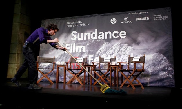 FILE PHOTO: Kevin Kane prepares the stage at an opening day news conference for the Sundance Film Festival in Park City, Utah, U.S. January 22, 2015. REUTERS/Jim Urquhart/File Photo