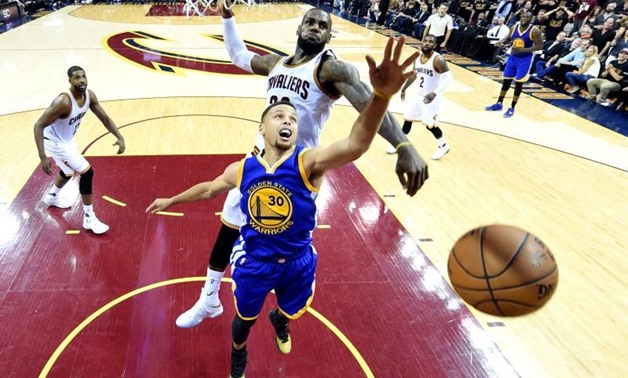 June 16, 2016; Cleveland, OH, USA; Cleveland Cavaliers forward LeBron James (23) blocks a shot by Golden State Warriors guard Stephen Curry (30) during the fourth quarter in game six of the NBA Finals at Quicken Loans Arena. Mandatory Credit: Bob Donnan-U
