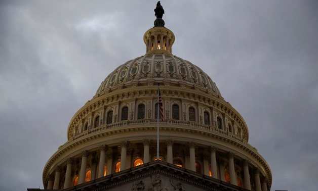 FILE- The U.S. Capitol building is lit at dusk ahead of planned votes on tax reform in Washington, U.S., December 18, 2017. REUTERS/Joshua Roberts