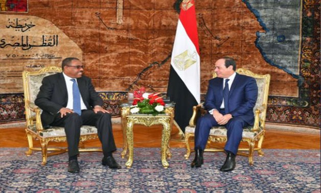 Egyptian President Abdel Fattah al-Sisi (R) and Ethiopian Prime Minister Hailemariam Desalegn talk during their meeting in the Egyptian Presidential Palace in Cairo, Egypt, January 18, 2018 - the Egyptian Presidency/Handout via Reuters