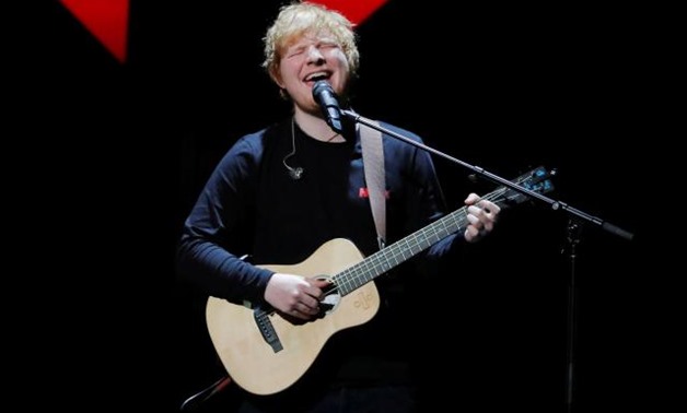 FILE PHOTO: Ed Sheeran performs during the 2017 Jingle Ball at Madison Square Garden in New York, U.S., December 8, 2017. REUTERS/Lucas Jackson/File Photo