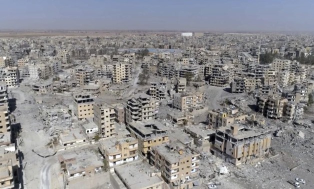 This Oct. 19, 2017, frame grab made from drone video shows damaged buildings in Raqqa, Syria - Reuters
