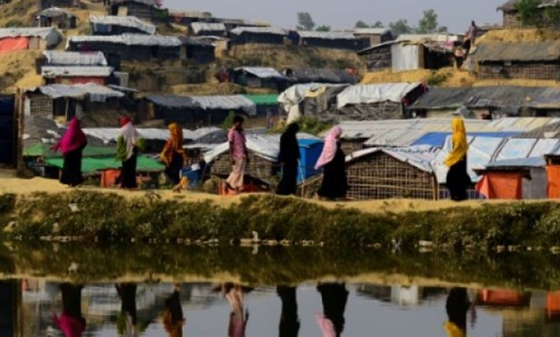AFP/File / by Richard Sargent, with Annie BANERJI in Cox's Bazar | Rohingya refugees pictured in November at Balukhali refugee camp in Bangladesh