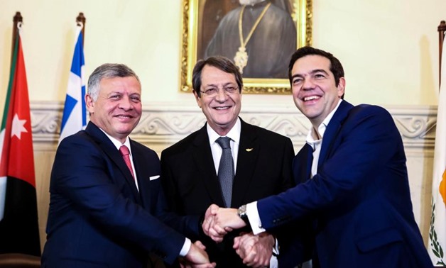 Cypriot President Nicos Anastasiades (C), Greek Prime Minister Alexis Tsipras (R) and Jordan's King Abdullah shake hands during a meeting at the Presidential Palace in Nicosia, Cyprus January 16, 2018. REUTERS/Iakovos Hatzistavrou/Pool