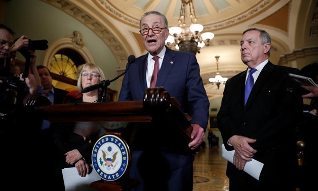 Senate Minority Leader Chuck Schumer, accompanied by Sen. Dick Durbin (D-IL) and Sen. Patty Murray (D-WA), speaks with reporters following the party luncheons on Capitol Hill in Washington, U.S. January 23, 2018. REUTERS/Aaron P. Bernstein
