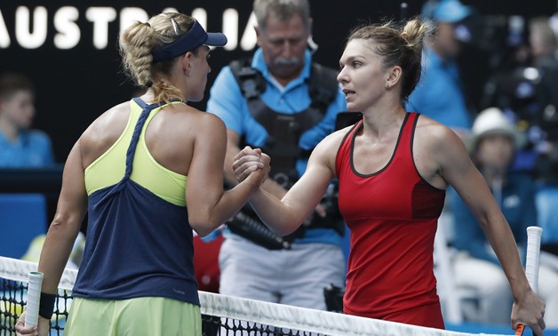 Rod Laver Arena, Melbourne, Australia, January 25, 2018. Simona Halep of Romania shakes hands with Angelique Kerber of Germany after Halep won their match. REUTERS/Issei Kato