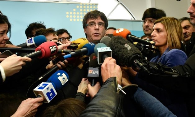 Centre of attention: atalonia's sacked leader Carles Puigdemont addresses reporters after meeting with the speaker of the Catalan regional Parliament in Brussels on Wednesday - AFP