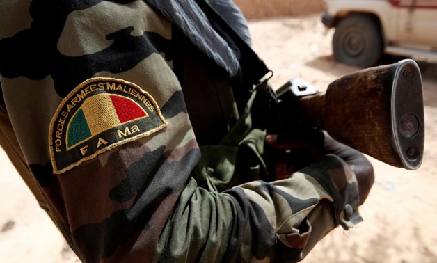 FILE PHOTO: A Malian Armed Forces patch worn by a soldier is pictured during the regional anti-insurgent Operation Barkhane in Tin Hama, Mali, October 19, 2017. REUTERS/Benoit Tessier/File Photo