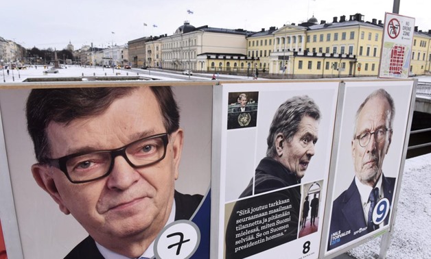 The campaign posters of the Finnish presidential candidates are seen in front of the presidential palace in Helsinki, Finland January 28, 2018 - Lehtikuva/Heikki Saukkomaa/via REUTERS