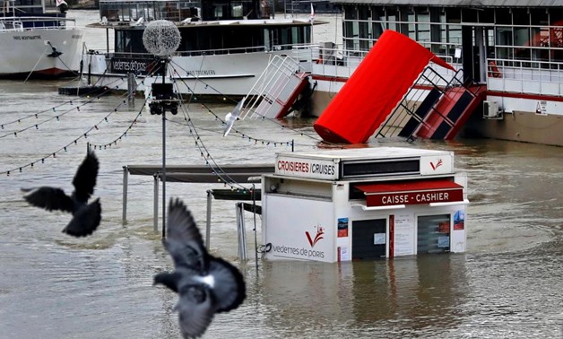 A ticket booth for sightseeing boats is partly submerged by the River Seine after days of almost non-stop rain caused flooding in the country, in Paris, France January 27, 2018 - REUTERS/Mal Langsdon