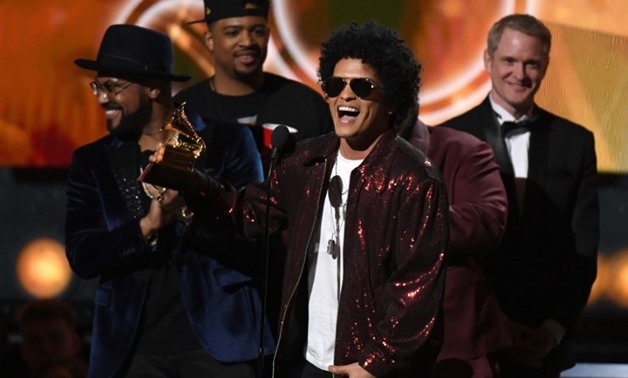 Bruno Mars receives his the Grammy for Album of the Year during the 60th Annual Grammy Awards show on January 28, 2018, in New York