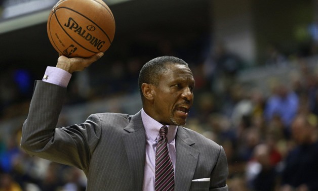 Toronto Raptors head coach Dwane Casey holds a ball while instructing his player on the bench during the first quarter of their NBA basketball game against the Indiana Pacers in Indianapolis, Indiana February 8, 2013. REUTERS/Brent Smith