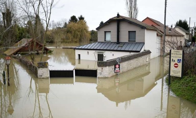There's plenty of mopping ahead for residents of illennes-sur-Seine, west of Paris - AFP
