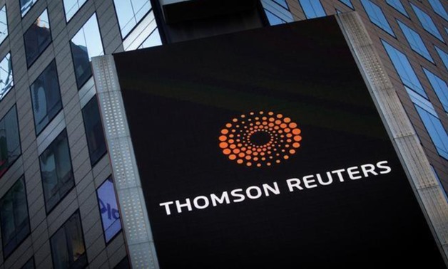 FILE PHOTO: The Thomson Reuters logo is seen on the company building in Times Square, New York October 29, 2013. REUTERS/Carlo Allegri/File Photo
