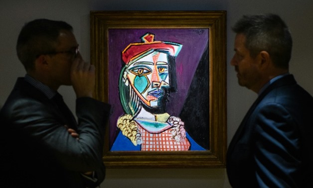 Picasso's "Femme au beret et a la robe quadrillee (Marie-Therese Walter)" will go under the hammer on February 28 after displays in Hong Kong, Taipei, New York and London
