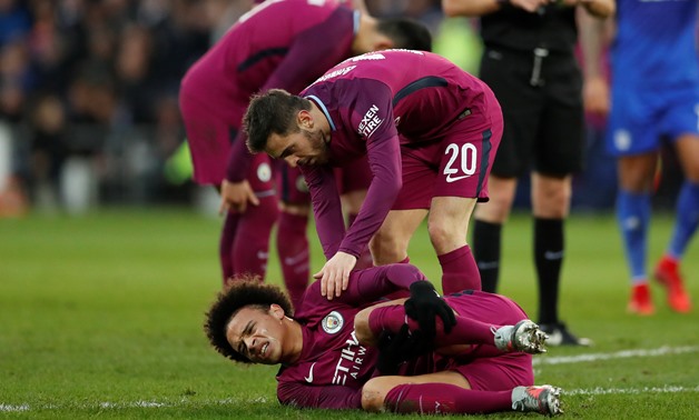 Soccer Football - FA Cup Fourth Round - Cardiff City vs Manchester City - Cardiff City Stadium, Cardiff, Britain - January 28, 2018 Manchester City's Leroy Sane reacts after sustaining an injury as Bernardo Silva looks on Action Images via Reuters/Andrew 