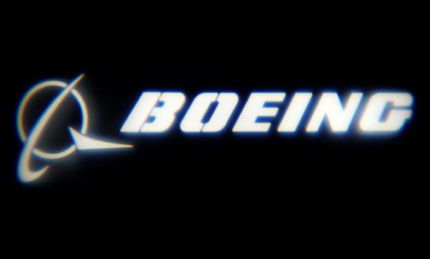 FILE PHOTO: The Boeing Company logo is projected on a wall at the "What's Next?" conference in Chicago, Illinois, U.S., October 4, 2016. REUTERS/Jim Young/File Photo