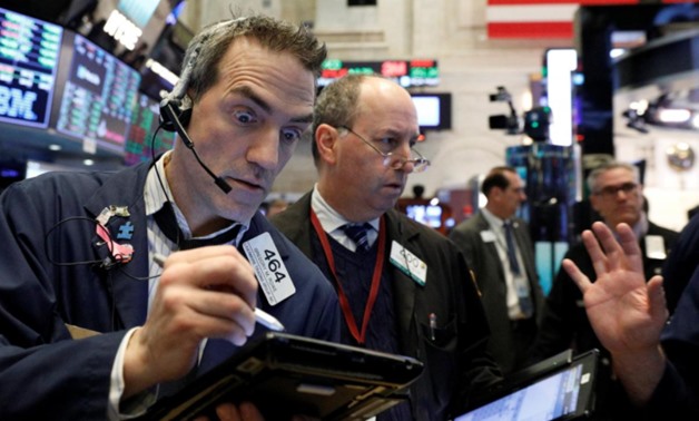 Traders work on the floor of the New York Stock Exchange (NYSE) in New York, U.S., January 31, 2018. REUTERS/Brendan McDermid